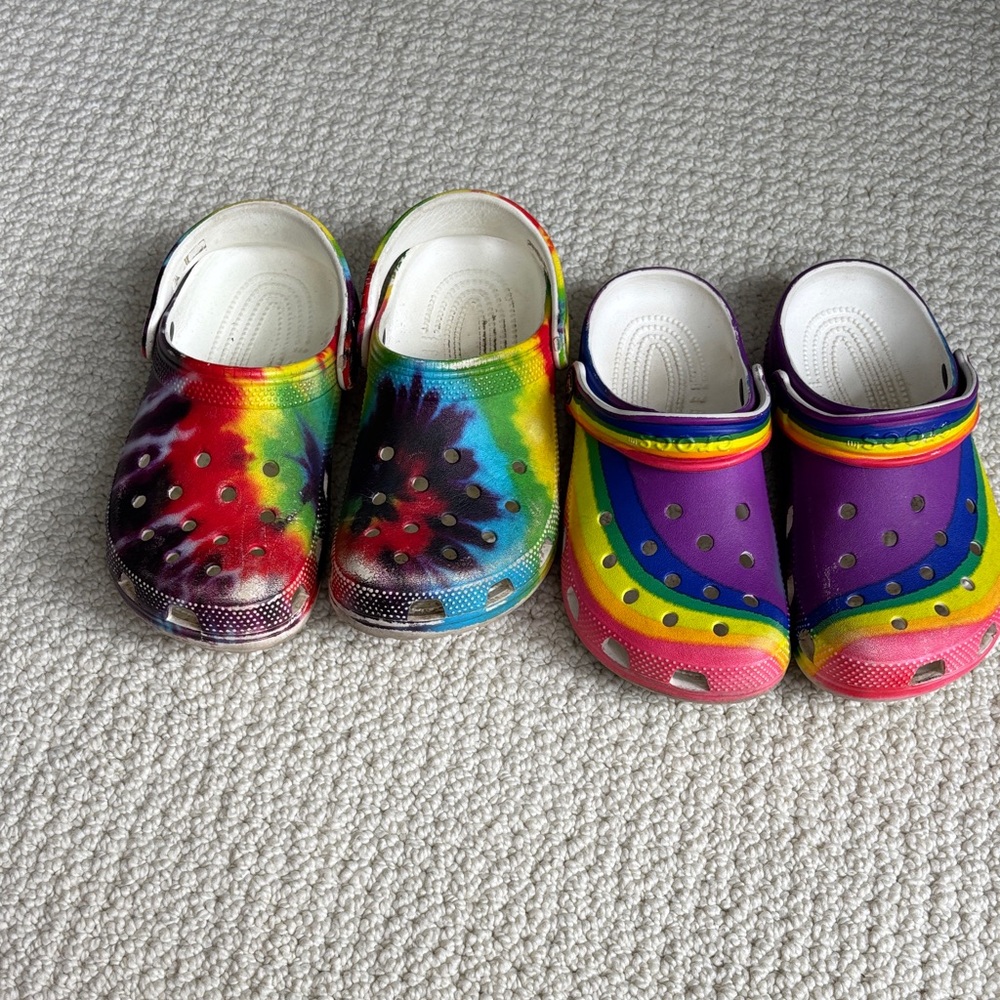 Crocs! 2 pair rainbow and tie dye. Size 2